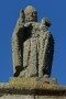 Statue of Saint Aubert standing on the gable of the chapel.