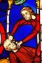 Musée de Cluny, a treasure trove of medieval art. This is a stained glass window showing a man torturing another man.