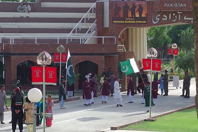 Before the start of the ceremony, Pakistani side: the one legged swirling flag waver is on the right, unfortunately with his back to us.