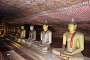 Dambulla's cave temples: line of sitting Buddhas in the meditating lotus posture.