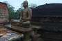 Polonnaruwa: oblivous to the rain falling on the Vatadage, Buddha remains stoic in his meditating posture.