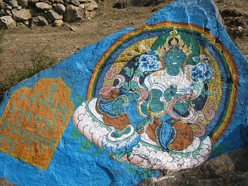 Painted stone: Buddha resting beside the trail