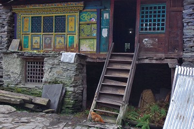 Day 8: typical house in Old Namrung with ornamented windows.