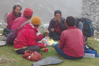 Day 14: the Tibetans having a break just before the ridge.