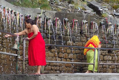 Day 25: women taking the waters under the spouts of Muktinath.