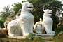 Sagaing: two fierceful lions guarding the access to the Aungmyelawka pagoda.