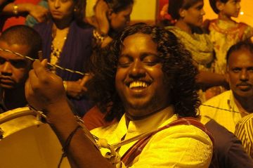 A street festival in Mysore: one of the drummers is having a really great time.