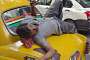 Kolkata: the city is famous for its yellow ambassador taxis. This taxi driver was just awakening from a nap on his car.