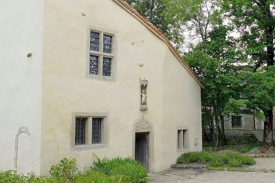 The birth house of Jeanne d'Arc. It has been enlarged and much improved over the years and has probably very little to do with the house she lived in. Over the door is the coat of arms of the family and a small statue of Jeanne.