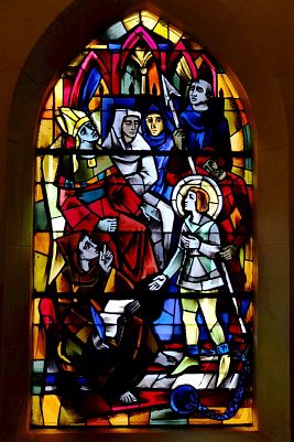 Stained-glass window from the church Saint-Rémy in Domrémy representing the trial of Jeanne.