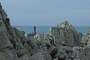 The lighthouse of La Vieille off the Pointe du Raz with the island of Sein in the background.