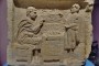 Gallo-Roman section: Roman funerary stela showing the shop of a jeweller, 2nd-3rd century AD. The customer is standing on the right while the jeweller sits on a chest on the left. The display includes bracelets, necklaces and some gems.