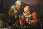 Greedy old couple weighing their possessions. Painting by Gillis Van Tilborgh (ca.1625-1678).