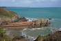 Between Pointe du Pommier and Pointe de Berjul: jetty at the Plage de Port Moguer with the rock formation called "Les Dames" off the shore.