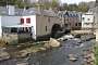 Pont-Aven lies inland right at the head of the ria of the river Aven, where freshwater meets the tidal waters. In the past, before tourism took over, the village was quite poor, one of its main resource coming from the water mills dotted along the ria; some are still standing but only the one featured on this picture (now a restaurant) boasts a still functioning wheel.