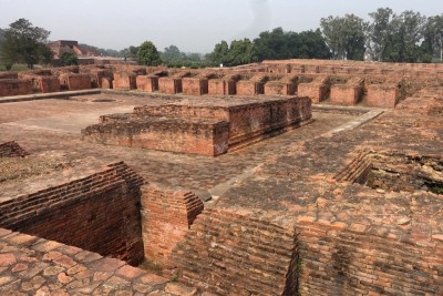 Ruins of a monastery in Nalanda; the monks' cells are clearly outlined around the central courtyard.