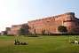 The ramparts of Agra Fort (January 2009). Built in the 16th century (completed in 1573), the fort is a feat of Mughal architecture and served as the main residence of the rulers of the Mughal dynasty until 1638, when the capital was shifted from Agra to Delhi.