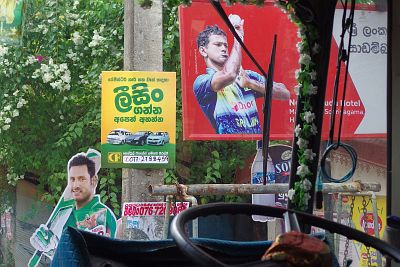 Street view from the inside of a tuk-tuk in Sri Lanka, a country where cricket players are stars and national heroes.