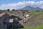 View of the ruins from the viewpoint west of the Porta Nocera with Mount Vesuvius in the background.