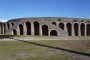 Amphitheatre (Regio II Insula: 6): it is the oldest of all existing buildings of this kind in the Roman world and is an imposing view. It could seat 20,000 people and was located in an area on the fringes of town to facilitate access of so many spectators.