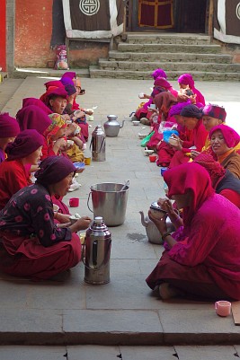 Tea and tsampa break for the nuns in the Thupten Choling Monastery's courtyard.