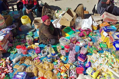 Salleri's Saturday market where you'll find nearly everything, from toothbrushes and toothpaste to sweets, noodle soups, incense sticks, biscuits, exercise books, washing powder, oil… Can you spot the batteries?