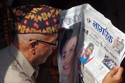 Man reading his paper in Kathmandu