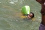 Ingenuous water wings for this little girl swimming in the Ganges in Varanasi.