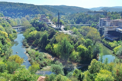 Bulgaria - The medieval town of Veliko Tarnovo has been built around bends of the Yantra river. View of the Asenevtsi Monument and the State Art Museum.