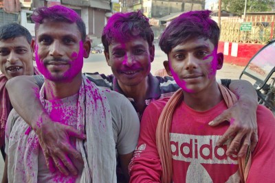 Agartala: happy young men still celebrating one day after the Holi festival was over.