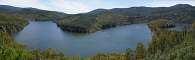 The river flowing downstream, the meander on the right.