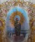 Banner with Our Lady of the Pillar standing in front of a depiction of Zaragoza featuring the basilica and the bridge over the river Ebro.