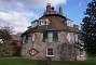 The 16-sided shape of the house is believed to have been inspired by the sixth-century Byzantine basilica of San Vitale at Ravenna. In its centre is a 10.7m high octogonal hallway (the Octagon), a hub opening into all other rooms and culminating in a central lantern reaching over the roof as can be seen on the picture.