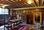 The hall with local oak panelling and a black and white floor.