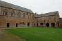 View of the cloister. The lower building on the right used to house the abbey's kitchen and oven and was extended as a farmhouse in the 17th century.