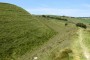 15.06.2022: Maiden Castle in Dorset, two miles south of Dorchester. We were not sure about this site but it was on our way, so we made a small detour and it was a very good idea. Its vast earth walls (or ramparts if you prefer), three of them in total, enclose an area the size of fifty football pitches which was home to several hundred people in the Iron Age (800 BC to AD 43 when the Romans took over the place). Of course, there is nothing left on the ground (except for the foundations of a Roman temple) but strolling through the central area and walking along the earth walls is very evocative. We were not disappointed.