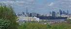 London's skyline seen from Blackheath. From left to right: the Chard, St Paul, the Walkie-Talkie and the Gherkin. This picture is a panorama. Press F to expand the picture to its real size and use the bottom scroll bar to navigate through it.