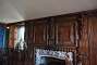 Fireplace with intricate wood panelling in the Morning Room.