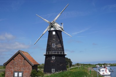 The Broads, Norfolk: a windmill along the river Yare.