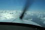Shortly after take off… we've just crossed the coast line near Southampton: what you see is the layer of broken cloud above the Channel. We were flying at 5000 feet; the clouds are a few hundred feet below us.