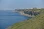 Looking back on the western cliffs with Chesil Beach visible in the background.