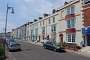 Row of houses lining the sea front promenade in Weymouth.