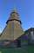 St Augustine in Brookland. The tower was built in the late 13th century as an open structure. It was doubled in height to its present 18m and clad with shingles in the 15th century.