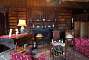 Inside the mansion house: the library and its elaborate chimney piece.