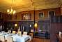 Inside the mansion house: the dining room with its beautiful wood panelling.